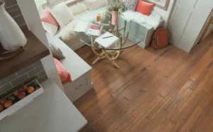 Year after year, hardwood flooring continues to be the most popular flooring option for homes. Although several flooring options mimic the classic look of hardwood, nothing beats the original, natural hardwood flooring. natural hardwood flooring Here are the top three reasons to choose natural, solid hardwood flooring. Durability. As long as it is properly maintained, hardwood can last a lifetime, even up to 100 years! And here is the good news: It is super easy to maintain. Simply sweep, vacuum, mop, and steam clean on a regular basis to maintain your natural hardwood’s integrity. While solid hardwood floors can be a pricy selection when you initially purchase them, in the long run this option will save you money as the cleaning supply is not expensive and you can forgo the cost of repairs. Additionally, natural hardwood’s colors won’t fade over time –in fact, the patina gets better with age. Valuable. For all the reasons mentioned above, natural hardwood floors can increase the value of your home. They are cleaner than carpets given that they are easily cleaned, and moreover, they are a hypoallergenic option and do not emit any potentially toxic fumes. Thus, hardwood’s value goes beyond even just your own personal use. Style. You have total creative control over hardwood floors, even years after you install them. You can add light or dark streaks, pick a pattern, and choose slabs that have knots. If after a few years you decide you want to switch the color, most flooring options require you to rip out and start from scratch but not hardwood. Depending on your floor’s warranty, you can refinish your hardwood floors and update them based on your own personal taste. In addition, hardwood is extremely complementary to any kind of furniture and decor. It also can make your space look bigger than it actually is. natural hardwood species Now that you are sold on solid hardwood, here are some of the highest recommended natural, solid hardwood species options. Oak. This historic hardwood flooring type has withstood the test of time both in durability and popularity. This strong species comes in two options (red and white oak), plus it’s often the most affordable hardwood option. Maple. With the lighter tone of wood, this hardwood works best in rustic homes. Walnut. This is the easiest hardwood to clean due to its smooth nature and comes in two different types: American and Brazilian. Bamboo. Technically, this is not a hardwood but rather, a grass that is compressed into planks. Because it’s a grass and grows in abundance, this is a much more ecofriendly flooring option. This is a newer type of flooring and may not be as durable as the other options. Pine. Due to its lower carbon footprint during production and transportation, this hardwood flooring is one of the more sustainable options. It’s also known to get better with age as its color will change over time. Cork. Ideal for rooms that need a sound dampener, this type of wood can be cut from a tree several times without harming it, making it a renewable resource. reasons to choose natural hardwood flooring With a plethora of species to choose from and so many reasons to go with natural hardwood, you’re guaranteed to find a floor that fits your flooring needs. Visit your local Flooring America to get connected with a qualified expert for more information and advice about natural hardwood flooring options.