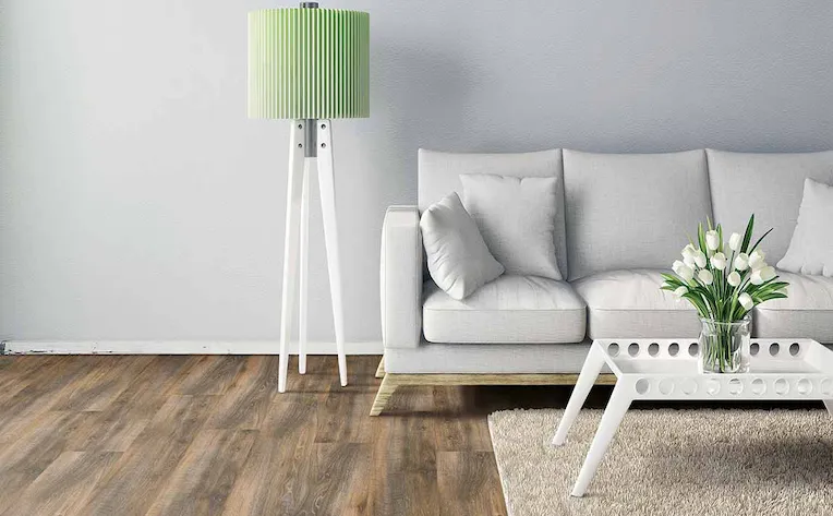 Living room with neutral grey paint and luxury vinyl plank flooring with a clean interior design 